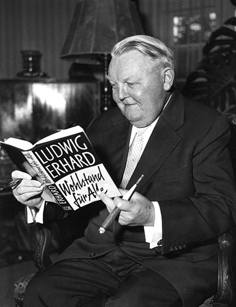Ludwig Erhard with his book <I>Prosperity for All</i> (January 28, 1957)