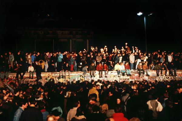 Opening of the Berlin Wall: Cheering Berliners on the Wall at Brandenburg Gate (November 9, 1989)