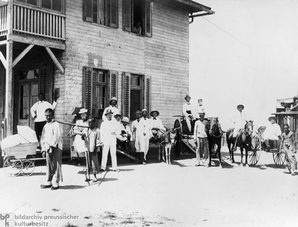 Europeans with Chinese Servants in Tsingtau (Kiaochow)  (c. 1900)